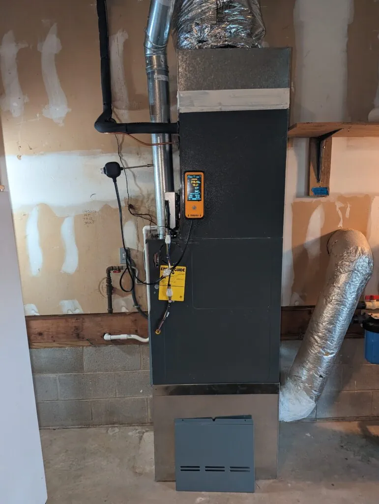 Combustion analyzer connected during a K&A Mechanical Daikin furnace installation